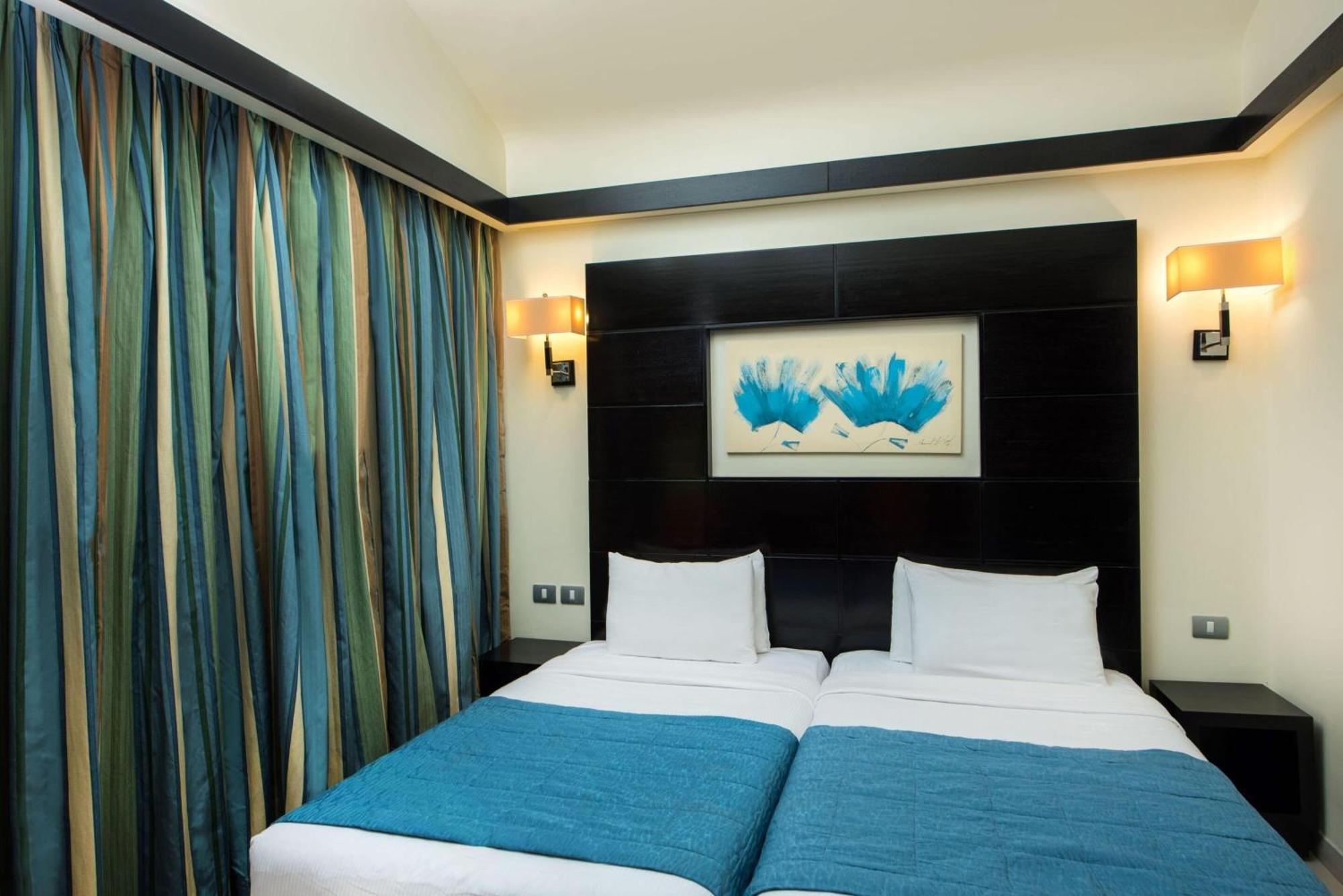 Reef Oasis Blue Bay Resort & Spa Sharm el-Sheikh Exterior foto A bedroom at the hotel